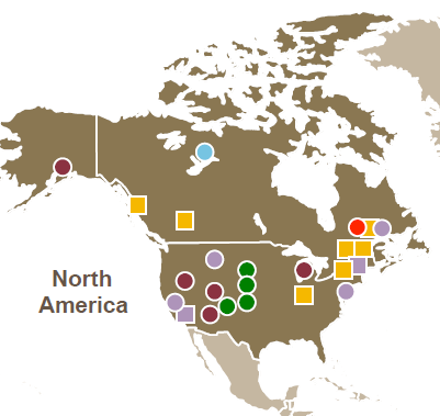 This image is a map of North America highlighting various resource extraction and mining operations. The map uses different colored circles and squares to represent different types of commodities or activities in specific locations across the continent. The colors include:

Red circles and yellow squares representing energy-related operations or resources.
Purple circles indicating minerals or diamond operations.
Green circles representing copper extraction or related activities.
Blue circles likely indicating aluminum operations.
The dots and squares are concentrated in regions such as the northeastern U.S., western Canada, and central U.S., indicating diverse resource extraction activities across North America. The map shows the distribution of these operations across various states and provinces.